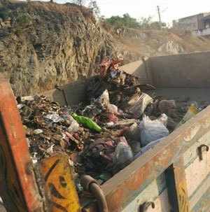 RTI members clear garbage, install dustbins