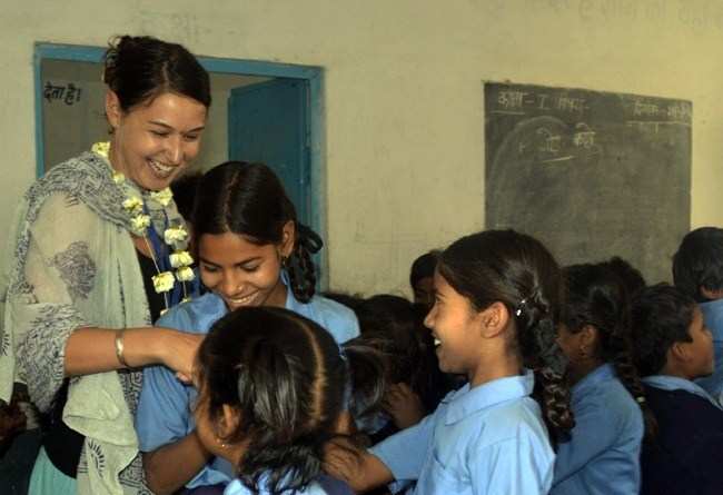 Foreign tourists help underprivileged students