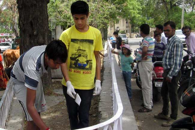 School students and local businessmen clean Panchwati Park