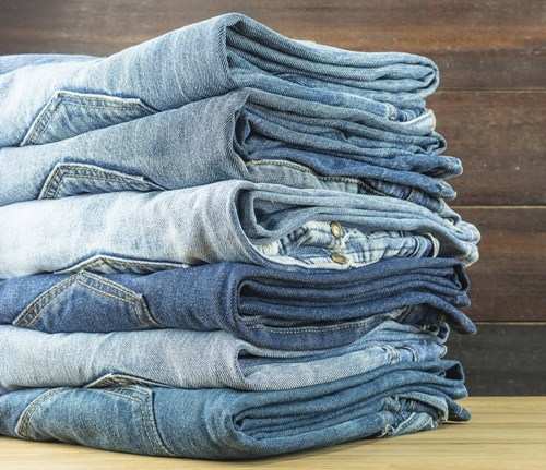 Women slip away with jeans from a ladies wear shop