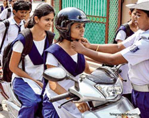 Two-wheeler entry in Schools only if students found wearing Helmet