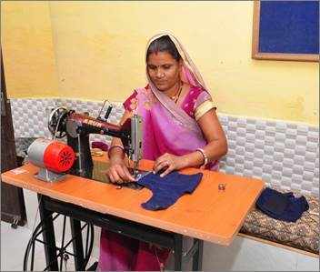 Sakhi Gayatri now owns a tailoring shop in her village