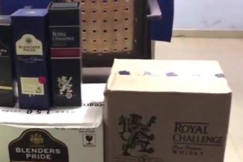 18 cartons of liquor confiscated-2 arrested