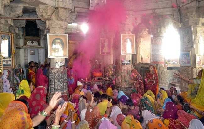 Devotees play Holi at Jagdish Temple