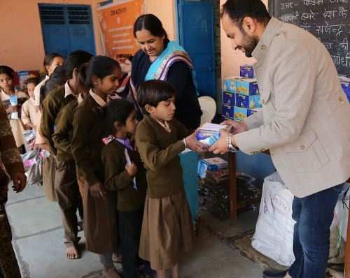 Sweaters and kits distributed by Ravi Infrabuild