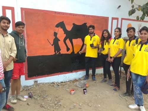 BN pharmacy students turn an ugly wall to a piece of art