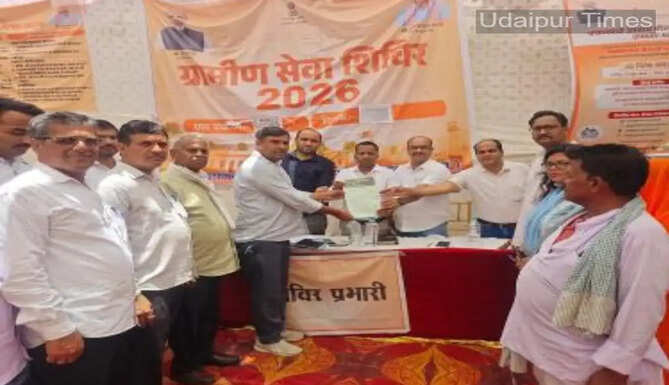 Government officials hand over the land lease (Patta) to Government Upper Primary School, Tula, after 64 years during the Rural Service Camp 2026 in Udaipur.
