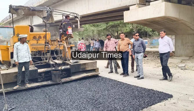 Deputy Commissioner Dr Naresh Soni inspecting ongoing patch work near Udaipur Elevated Road.