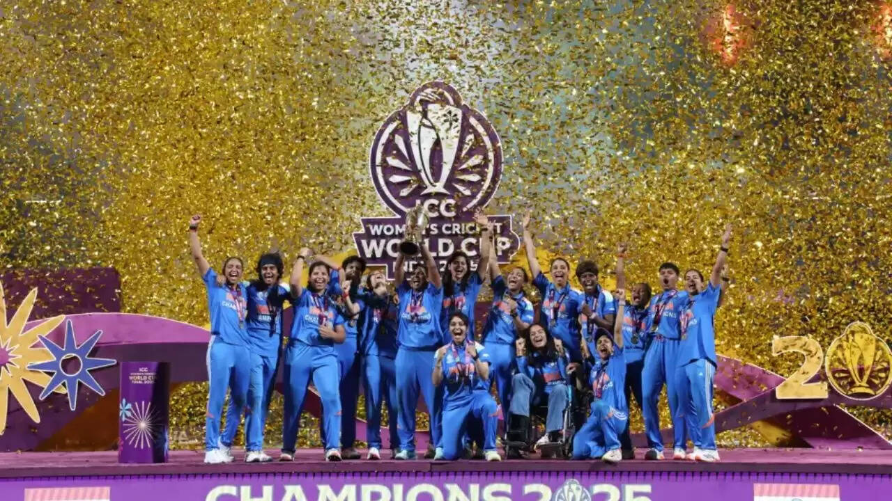 Indian women cricket team lifting ODI World Cup trophy after defeating South Africa in Mumbai final