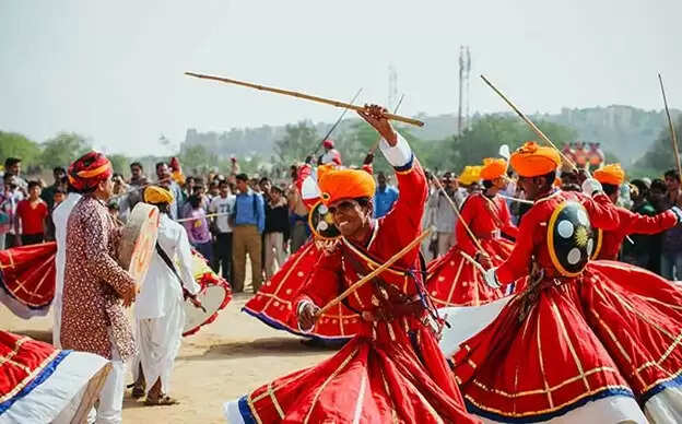 Top 10 Reasons to Visit Rajasthan for Your Next Trip Rajasthan travel  Rajasthan tourism  Rajasthan tour packages  Jaipur sightseeing  Udaipur lakes  Jodhpur Blue City  Jaisalmer desert safari  Rajasthan forts and palaces  Rajasthani cuisine  Rajasthan culture and festivals  Best time to visit Rajasthan  Rajasthan travel tips  India travel destinations Colorful Rajasthani folk dance during festival celebration
