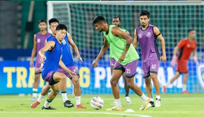 Mohammedan Sporting players and Mumbai City FC footballers during crucial ISL 2025-26 match in Kolkata