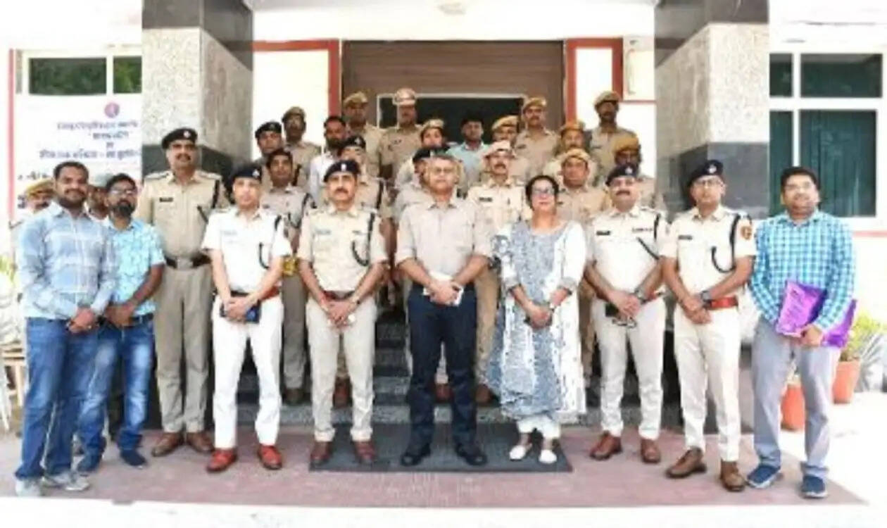 Udaipur Range Police officials conducting Cyber Shield and road safety awareness workshop at Police Line auditorium with participants and UNICEF representatives.