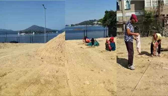 Temporary beach volleyball court being prepared behind Mahakal Temple at Fateh Sagar Lake, Udaipur.