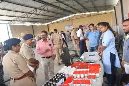Doctors conducting health check-ups for Chittorgarh police personnel at the medical camp organized by MP Birla Hospital.