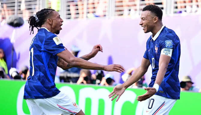 Kylian Mbappe and Michael Olise celebrate after combining for another goal during France's FIFA World Cup campaign.