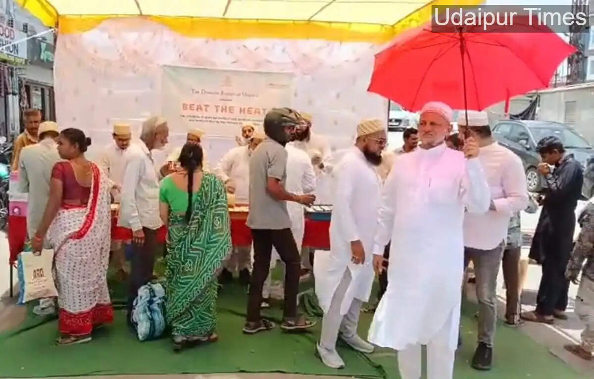 Members of the Bohra community distribute chilled buttermilk under the &lsquo;Beat the Heat&rsquo; initiative at Delhi Gate intersection in Udaipur to provide relief from rising summer temperatures.