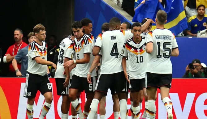 Germany players celebrate during a 7-1 World Cup victory over Curacao, who scored their first-ever goal at a FIFA World Cup through Livano Comenencia.
