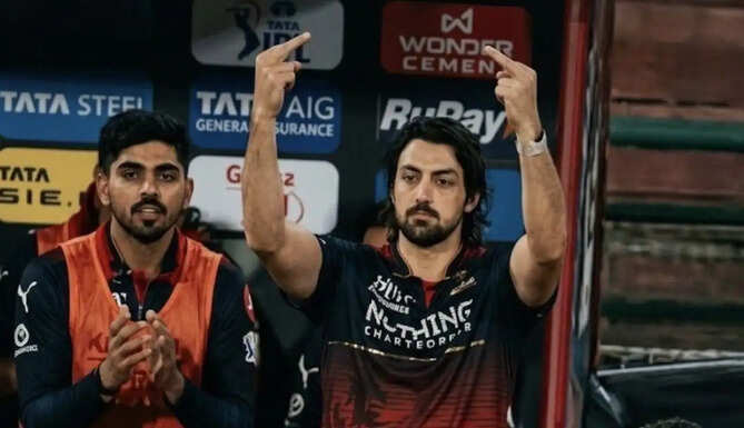 RCB batter Tim David celebrates IPL 2026 title win as he faces a fine and suspension following the final against Gujarat Titans.