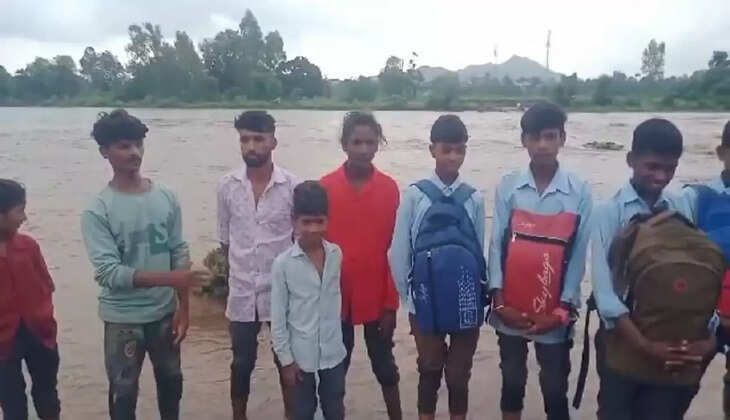 Students crossing river at Jhadol