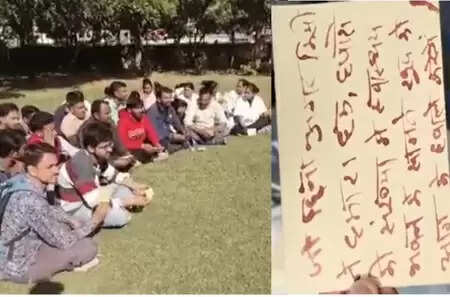 Contract nursing staff protesting at RNT Medical College Udaipur by writing demands with blood