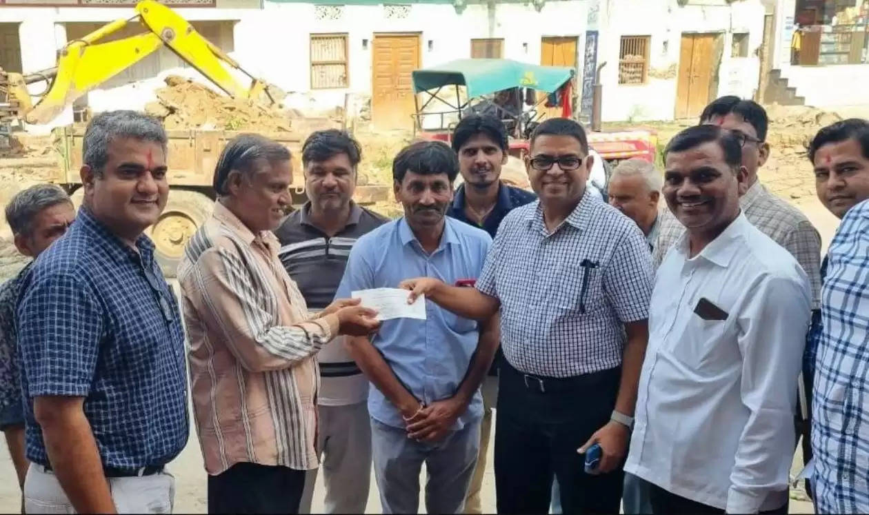 Compensation cheques distributed by UIT at Badgaon