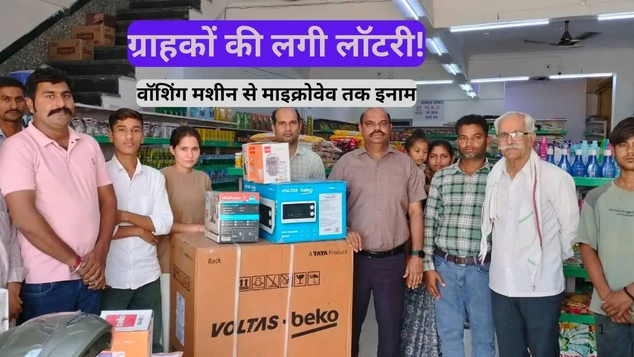 Winners receiving prizes at Supermarket Salumber lucky coupon scheme