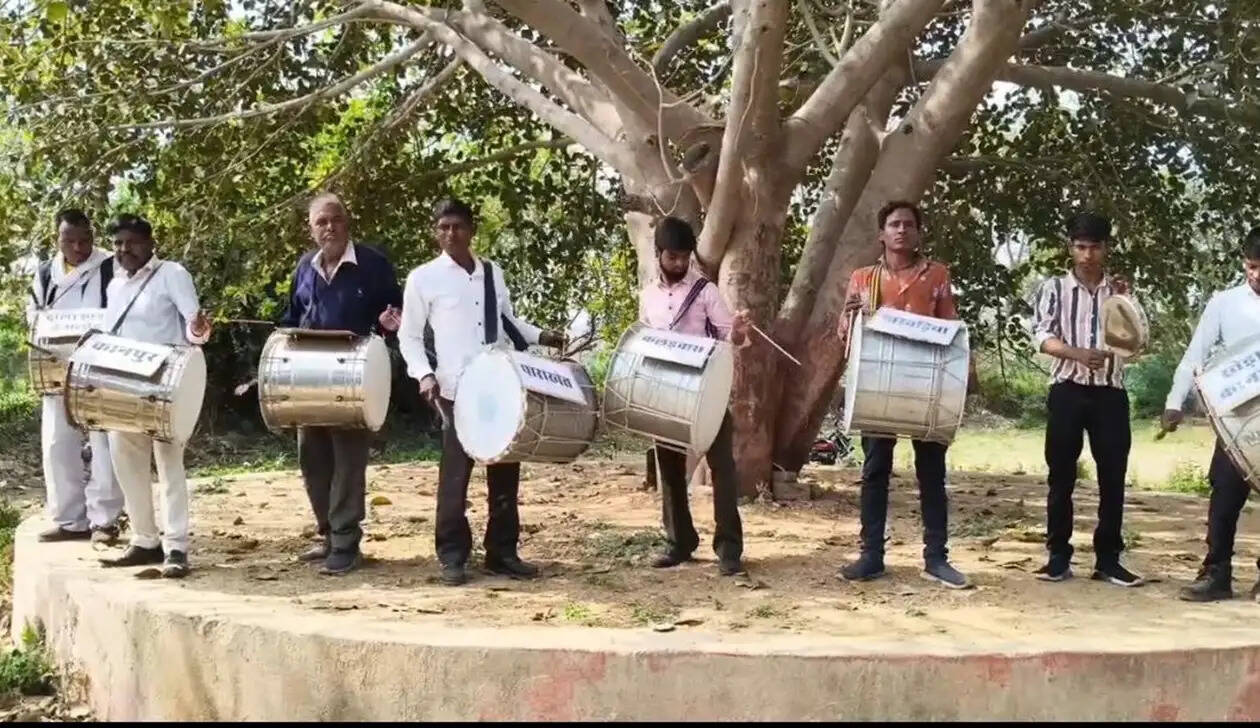 Villagers from 12 villages protesting against Ayad River pollution near Kanpur Kheda bridge in Udaipur, Rajasthan, beating drums to demand action.