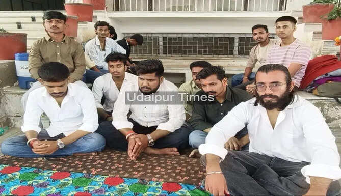 Student leaders on indefinite hunger strike outside Mohan Lal Sukhadia University administrative building in Udaipur demanding student union elections and academic reforms.