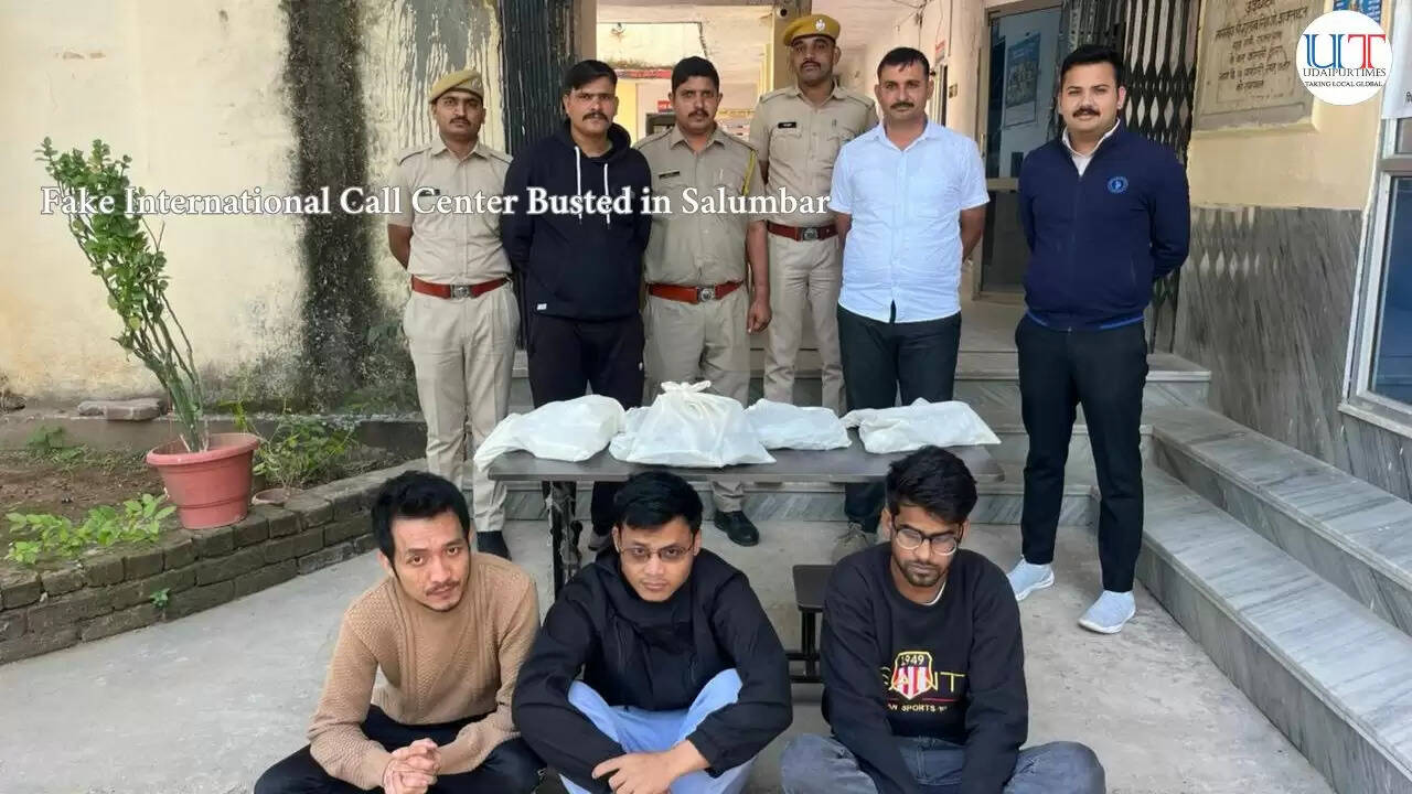 Police officers display seized laptops and mobile phones after busting a fake call center in Udaipur&rsquo;s Salumbar area