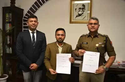 Udaipur Range Police officials and Ambuja Foundation representatives signing MoU for youth skill development and crime prevention